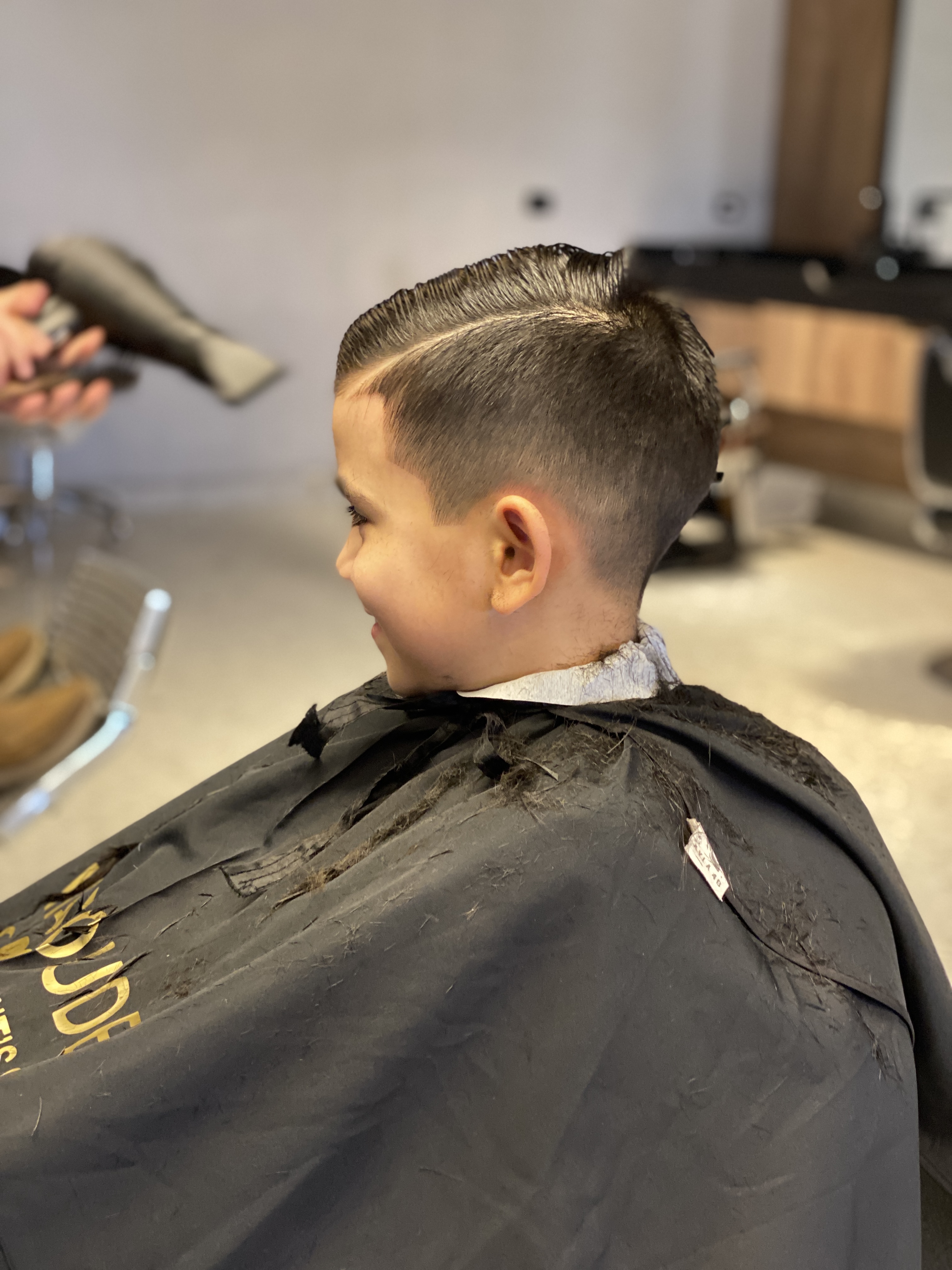 Finished side-part fade with a clean blow-dry at Hamoudeh Gent's Salon
