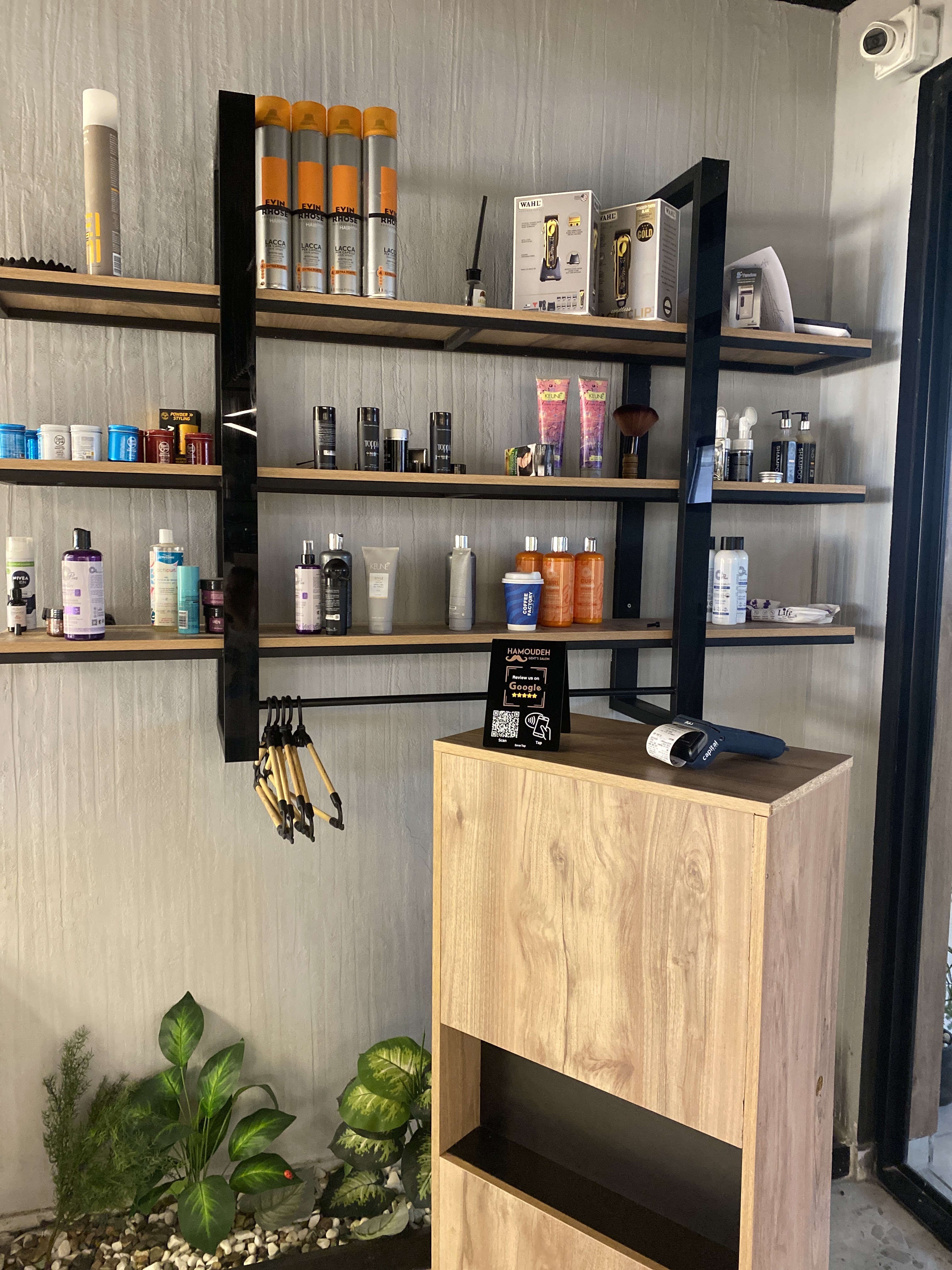 Shelves stocked with grooming products beside the checkout counter